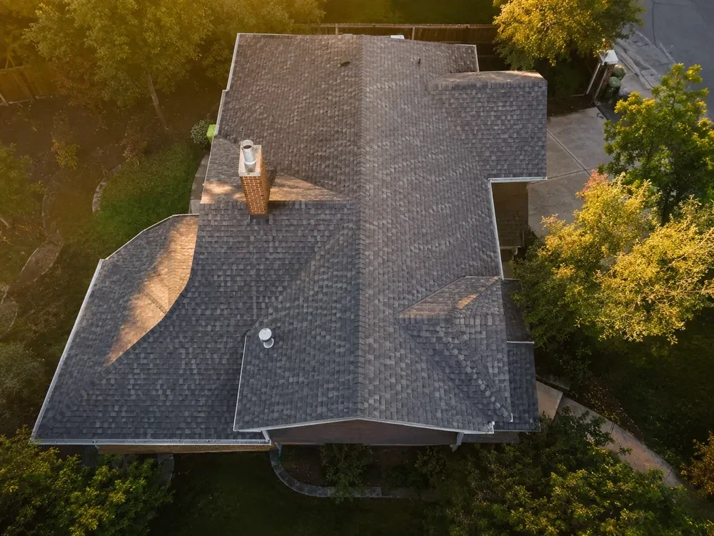 Aerial drone view of an asphalt shingle roof during an inspection